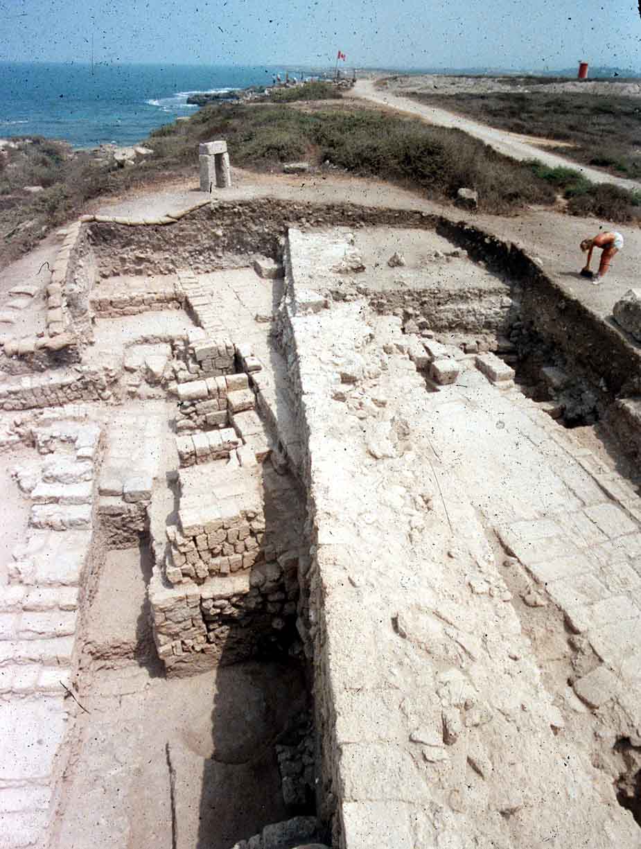 The staircase leading down to the southern doorway of the perambulatory (left) and its retaining wall (center), overlaying an early Roman street (right)