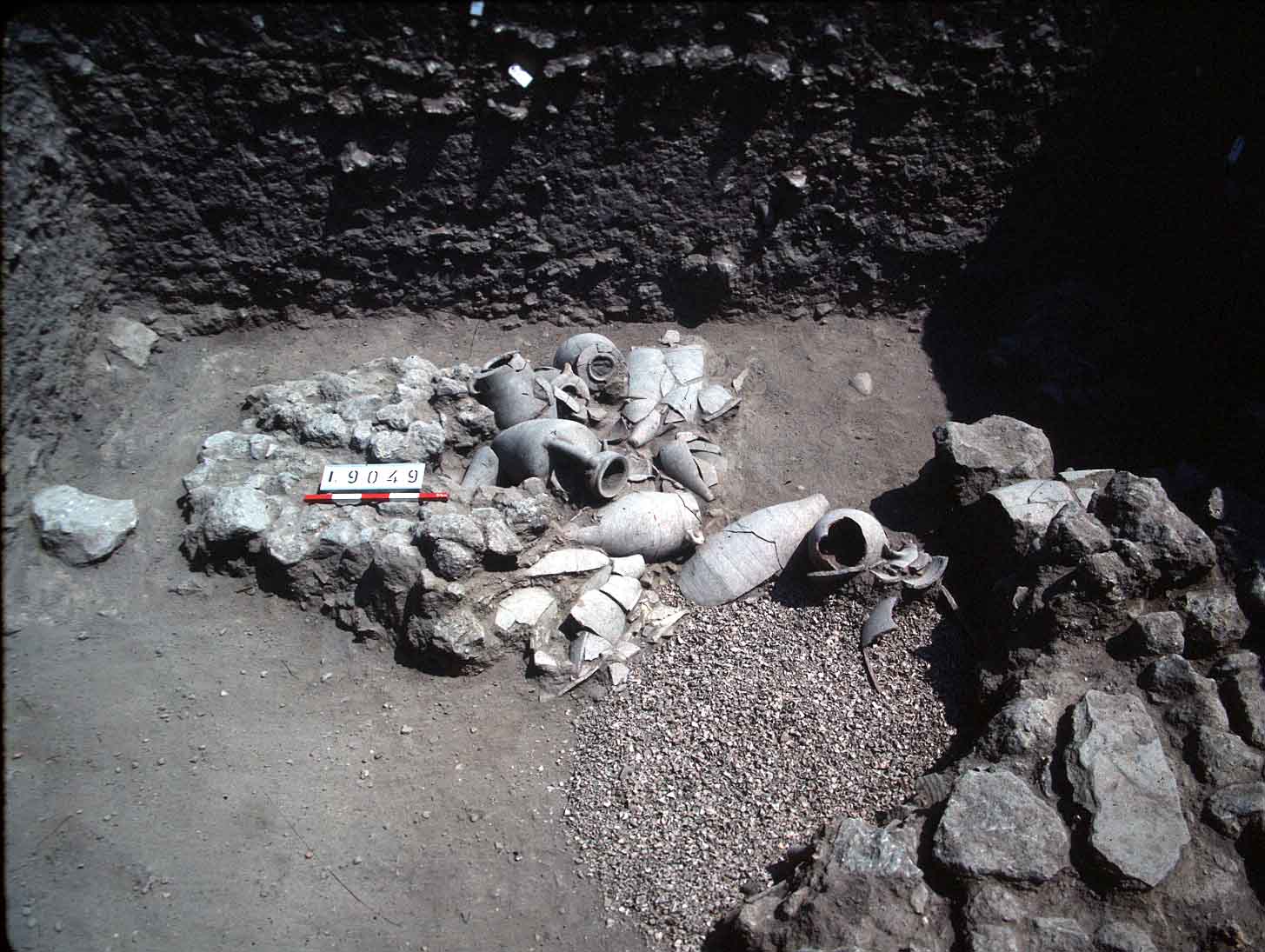 Persian pit with storage jars and crushed murex shells